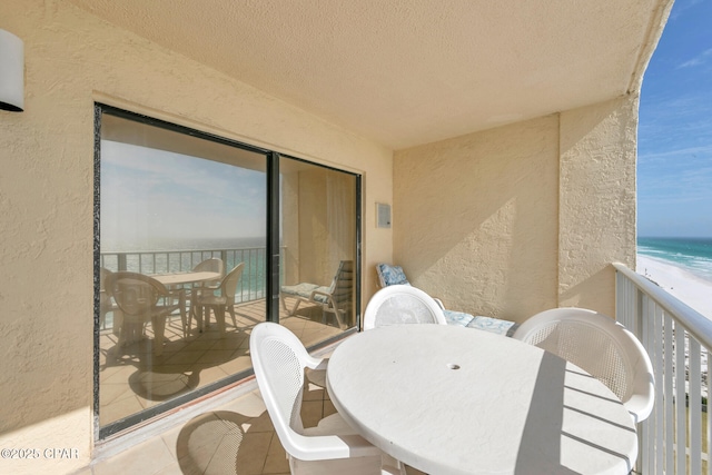5801 Thomas Dr Unit 1216, Panama City Beach, FL 32408 - balcony with outdoor dining space, a water view, and a view of the beach