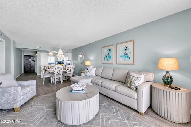 5801 Thomas Dr Unit 1216, Panama City Beach, FL 32408 - living area featuring a textured ceiling and wood finished floors