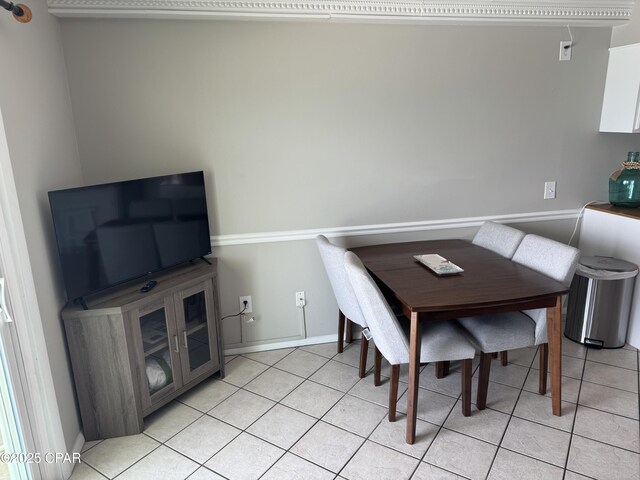 8743 Thomas Dr Unit 1328, Panama City, FL 32408 - dining space with baseboards and light tile patterned flooring