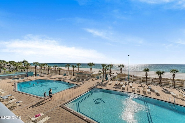 8743 Thomas Dr Unit 1328, Panama City, FL 32408 - community pool with a patio, fence, and a water view