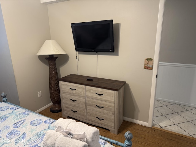 8743 Thomas Dr Unit 1328, Panama City, FL 32408 - bedroom with light wood-style flooring and baseboards