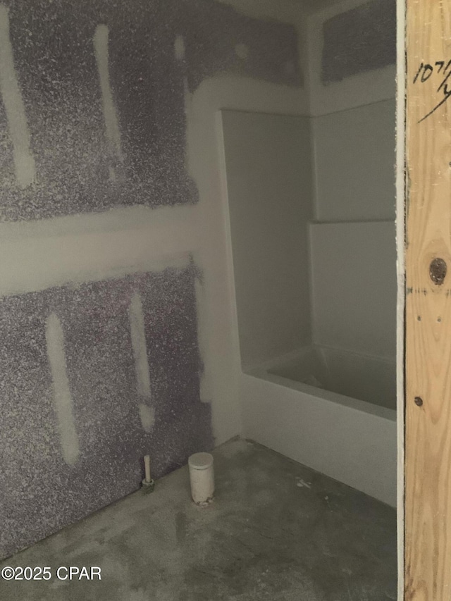 bathroom with unfinished concrete floors