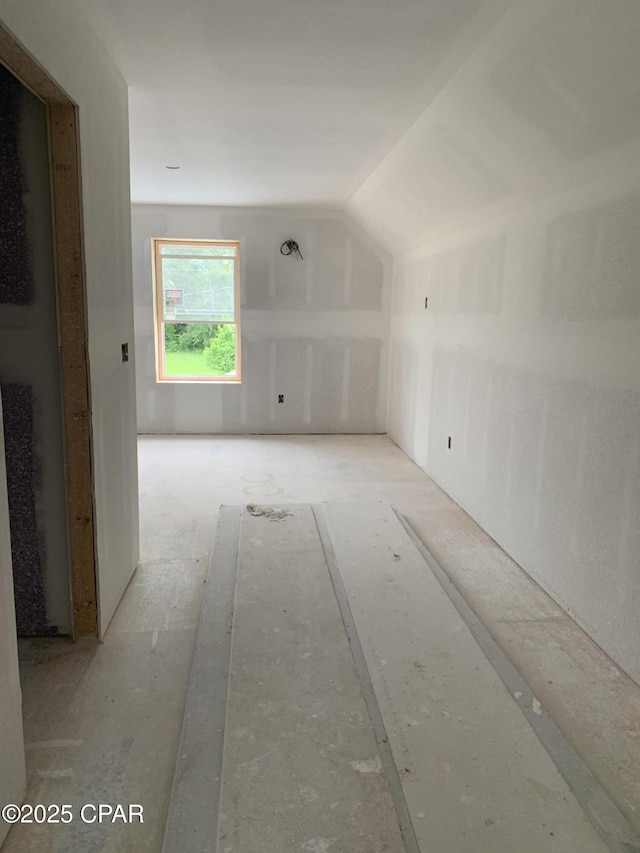 bonus room featuring vaulted ceiling