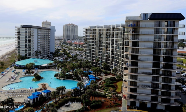 view of apartment building / complex featuring a view of city and a community pool