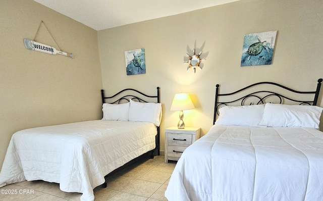 bedroom featuring tile patterned flooring
