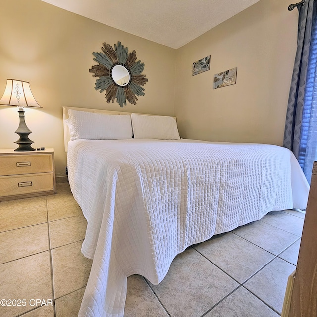 bedroom with light tile patterned flooring