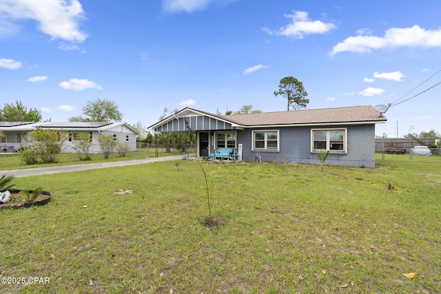 single story home with driveway, a front lawn, and fence