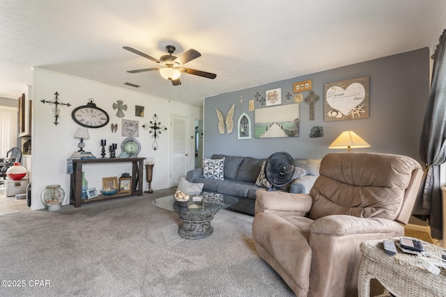 living room featuring ceiling fan, carpet floors, and visible vents