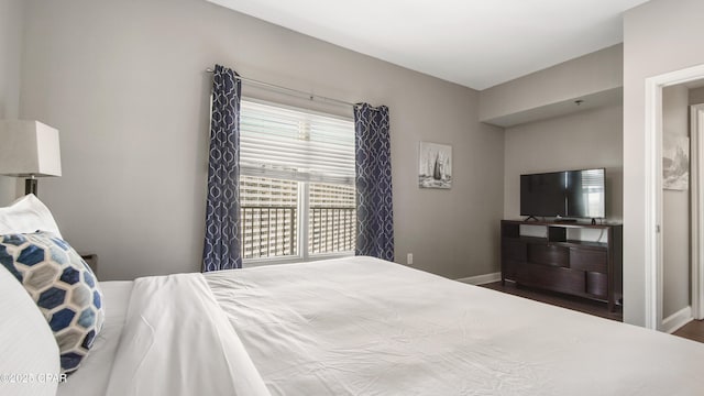 9900 S Thomas Dr Unit 1719, Panama City Beach, FL 32408 - bedroom with baseboards and wood finished floors