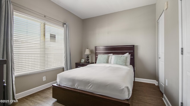 9900 S Thomas Dr Unit 1719, Panama City Beach, FL 32408 - bedroom featuring wood finished floors and baseboards