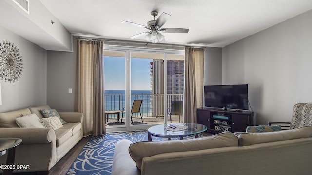 9900 S Thomas Dr Unit 1719, Panama City Beach, FL 32408 - living room featuring dark wood-style flooring and ceiling fan