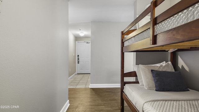 9900 S Thomas Dr Unit 1719, Panama City Beach, FL 32408 - bedroom featuring wood finished floors and baseboards