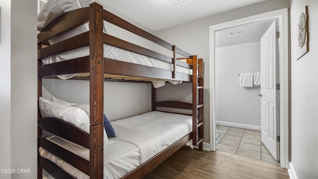 9900 S Thomas Dr Unit 1719, Panama City Beach, FL 32408 - bedroom featuring wood finished floors and baseboards
