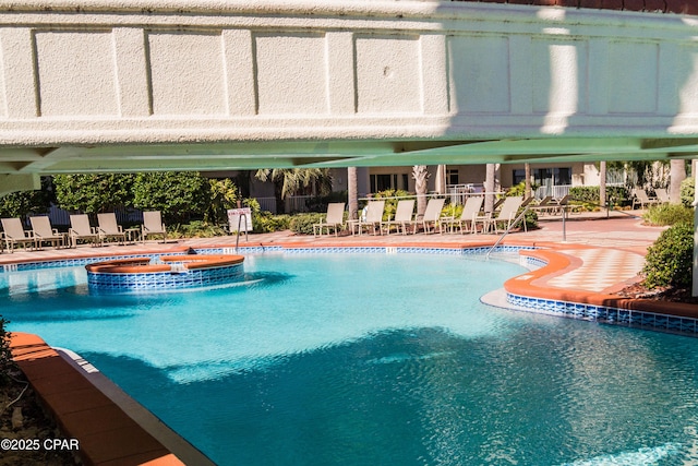 9900 S Thomas Dr Unit 1719, Panama City Beach, FL 32408 - view of pool with a pool with connected hot tub and a patio area