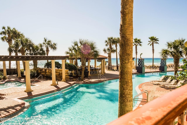 9900 S Thomas Dr Unit 1719, Panama City Beach, FL 32408 - community pool featuring a patio area, a gazebo, and a water view
