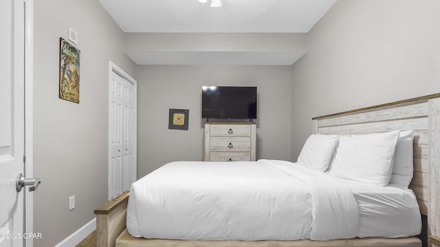 bedroom featuring a closet and baseboards