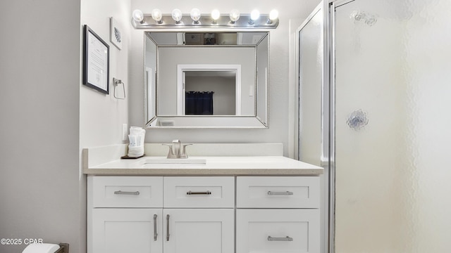 full bath with a shower stall and vanity