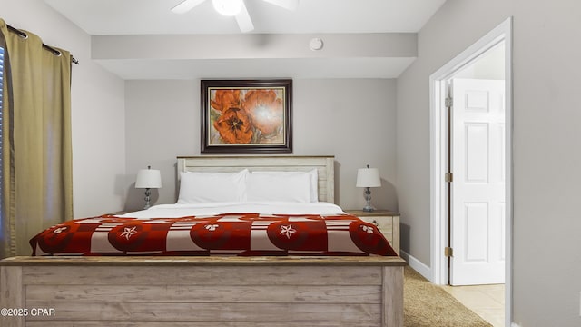 bedroom featuring ceiling fan and light tile patterned floors
