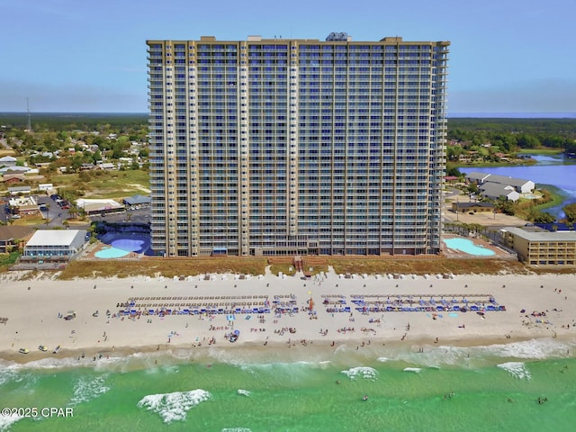 view of property featuring view of water and beach