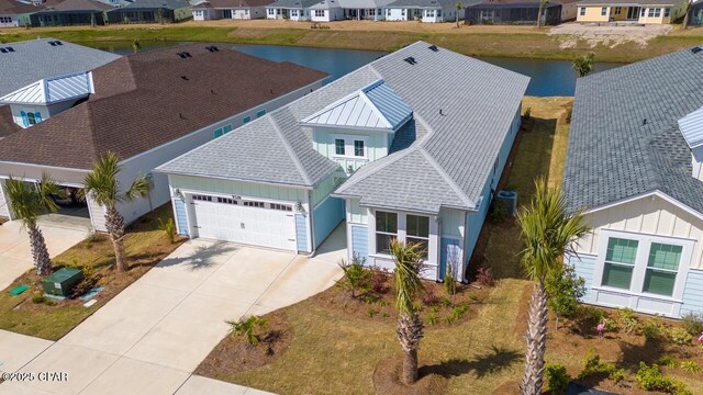 aerial view with a water view and a residential view