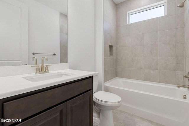 bathroom featuring toilet, tile patterned floors, vanity, and bathtub / shower combination