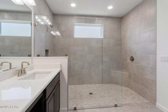 full bath with recessed lighting, tile patterned floors, vanity, and walk in shower