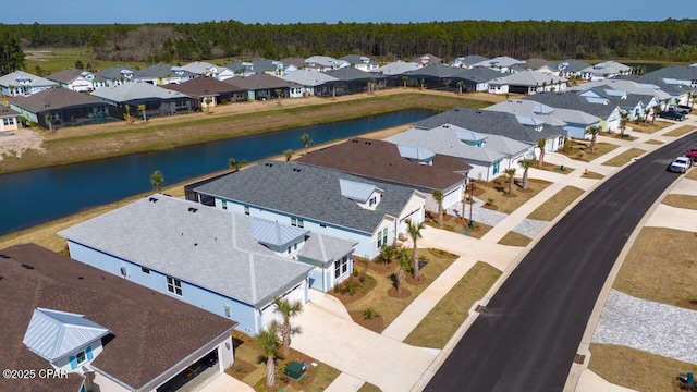 bird's eye view with a water view, a residential view, and a forest view