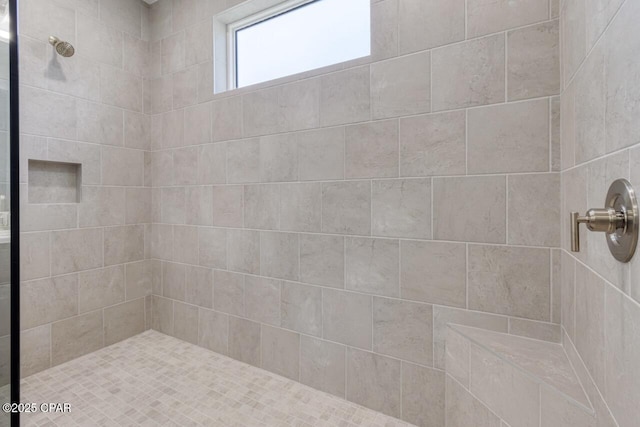 full bath featuring a tile shower