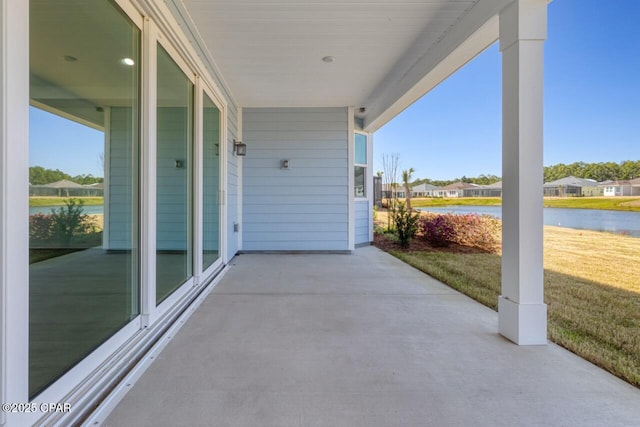 view of patio / terrace featuring a water view