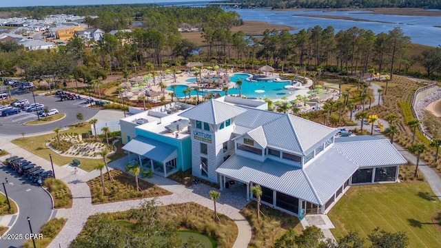 birds eye view of property with a water view