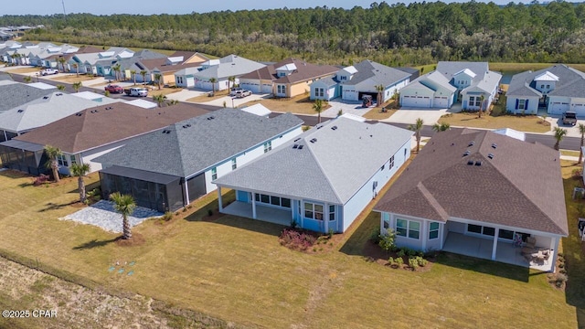 aerial view with a forest view and a residential view