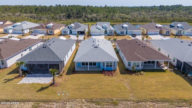 aerial view with a forest view and a residential view
