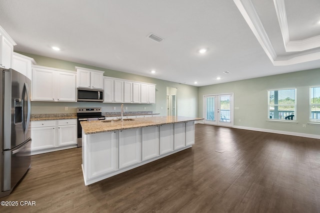 365 Confidence Way, Panama City, FL 32409 - kitchen with stainless steel appliances, a sink, dark wood-style floors, white cabinetry, and light stone countertops