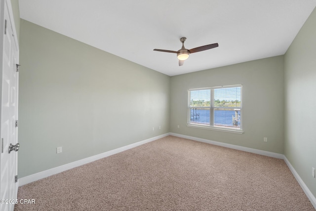 365 Confidence Way, Panama City, FL 32409 - spare room featuring ceiling fan, light carpet, and baseboards