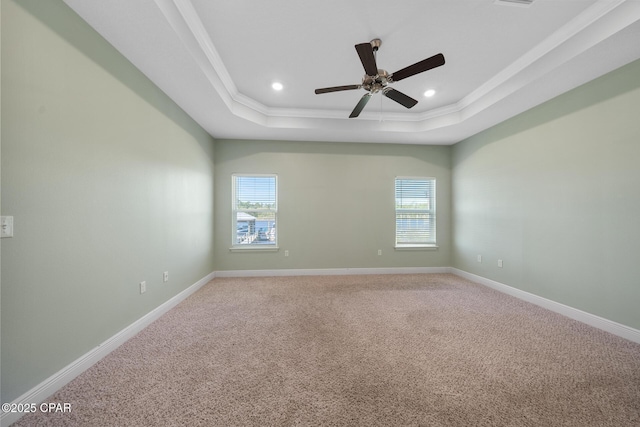 365 Confidence Way, Panama City, FL 32409 - unfurnished room featuring a raised ceiling, plenty of natural light, baseboards, ornamental molding, and recessed lighting