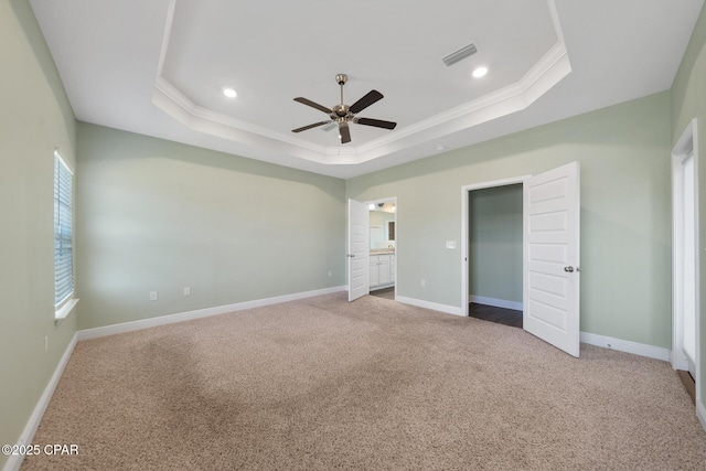 365 Confidence Way, Panama City, FL 32409 - unfurnished bedroom with a raised ceiling, ornamental molding, carpet flooring, baseboards, and recessed lighting