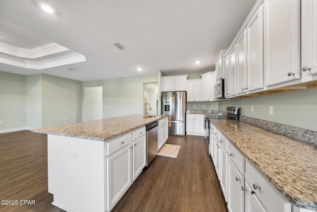 365 Confidence Way, Panama City, FL 32409 - kitchen with appliances with stainless steel finishes, dark wood-style flooring, a sink, white cabinets, and recessed lighting