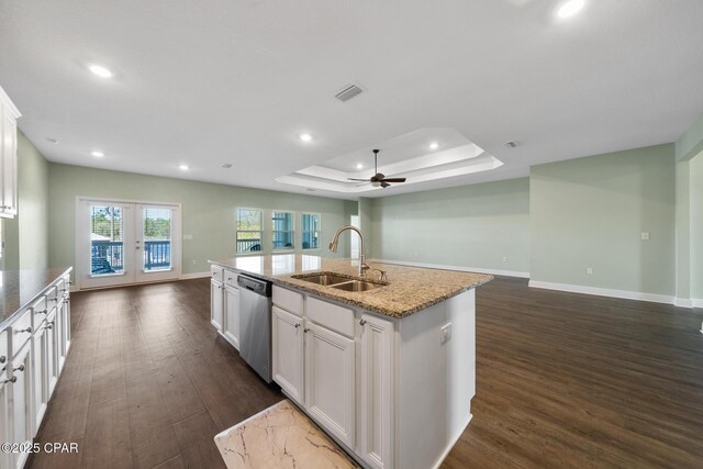 365 Confidence Way, Panama City, FL 32409 - kitchen with a sink, stainless steel dishwasher, open floor plan, dark wood-type flooring, and a tray ceiling