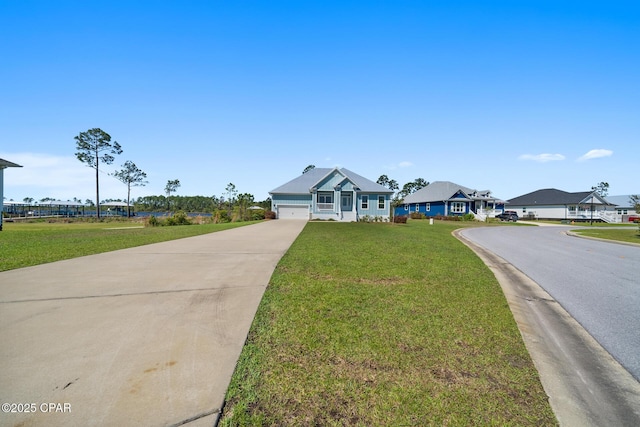 365 Confidence Way, Panama City, FL 32409 - view of front of house featuring driveway, a front yard, and an attached garage