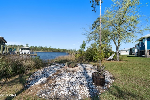 365 Confidence Way, Panama City, FL 32409 - view of green lawn with a fire pit and a water view