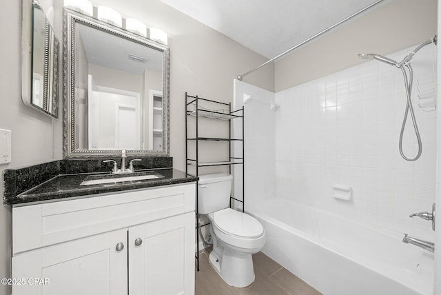 full bathroom featuring visible vents, toilet, shower / tub combination, and vanity