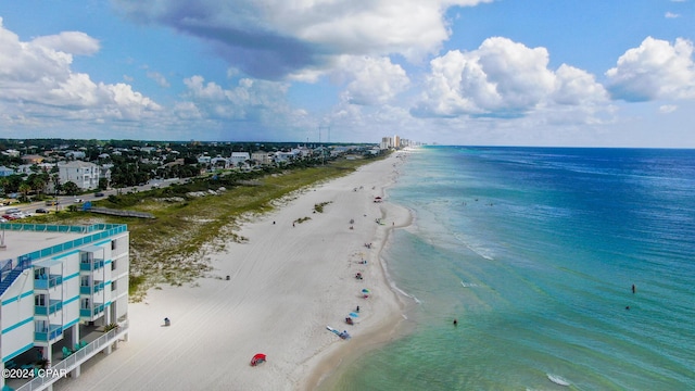 drone / aerial view featuring a view of the beach and a water view