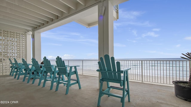 view of patio / terrace with a water view and a balcony