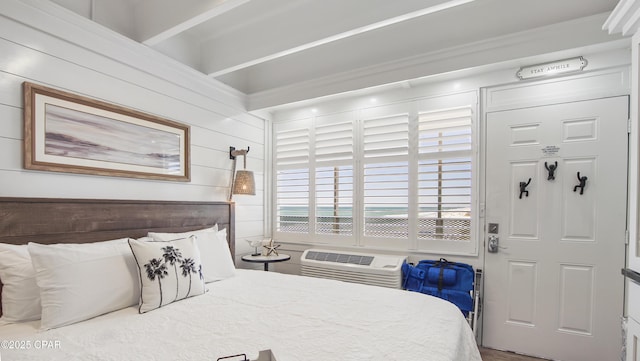 bedroom with a wall unit AC