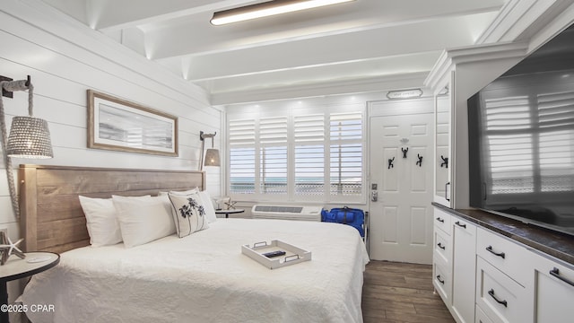 bedroom with dark wood-style floors
