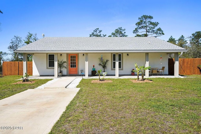 single story home featuring a shingled roof, stucco siding, fence, and a front yard