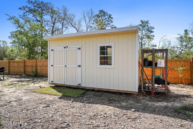 view of shed with a fenced backyard