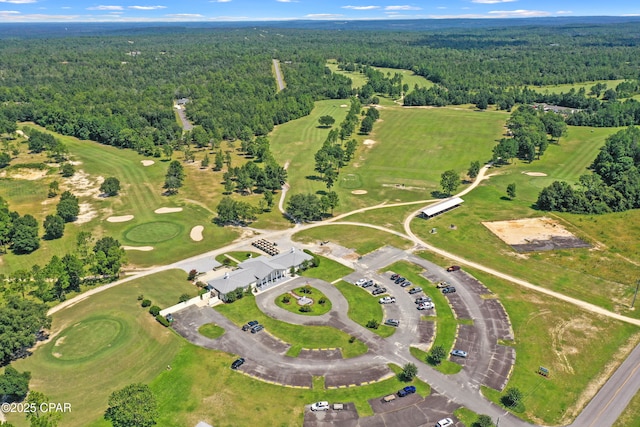 drone / aerial view featuring a view of trees