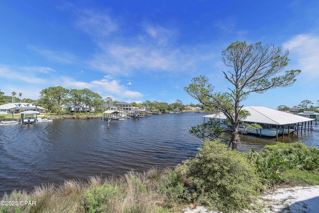 property view of water featuring a dock and boat lift