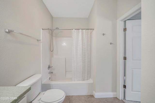full bathroom with tile patterned flooring, toilet, vanity, shower / bath combo with shower curtain, and baseboards